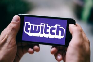 person watching a twitch stream on their phone