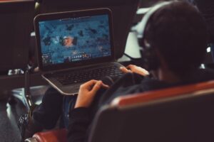 man playing video games on his laptop while streaming